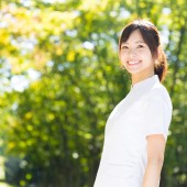 young asian nurse in the park
