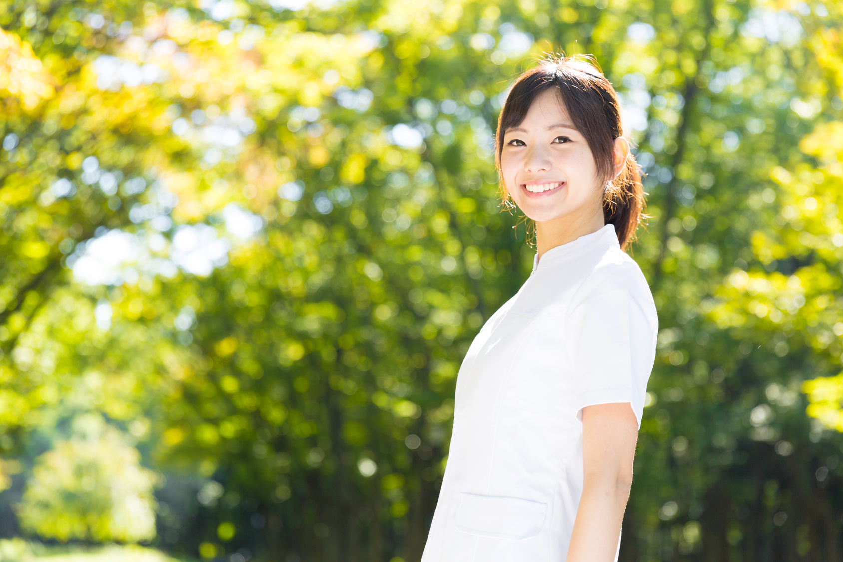 young asian nurse in the park